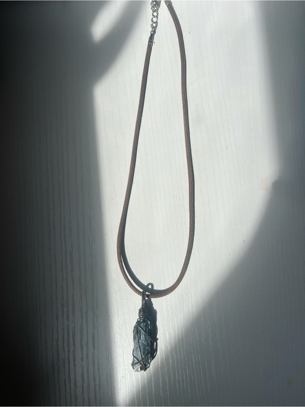 Handcrafted Brown Cord Necklace with Wrapped Blue Kyanite Crystal Pendant